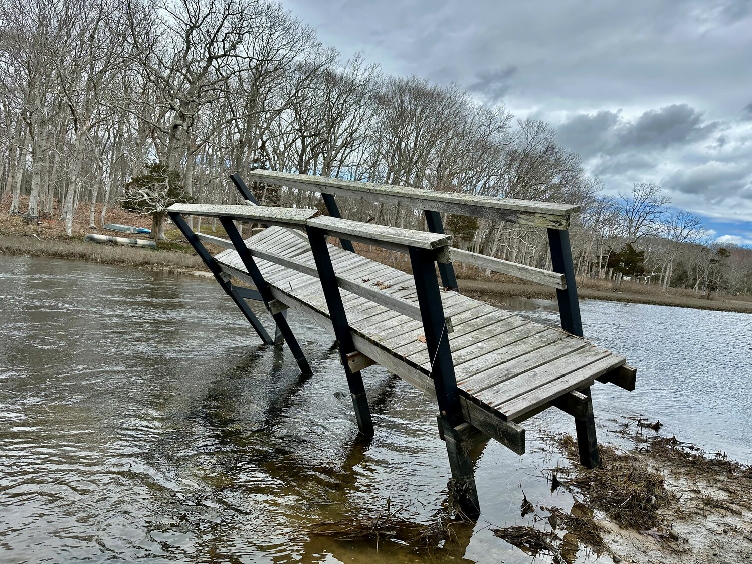 The bridge on North Haven's Loop Trail was knocked off its pilings by a nor'easter last spring. COURTESY CAMILLE PETRILLO