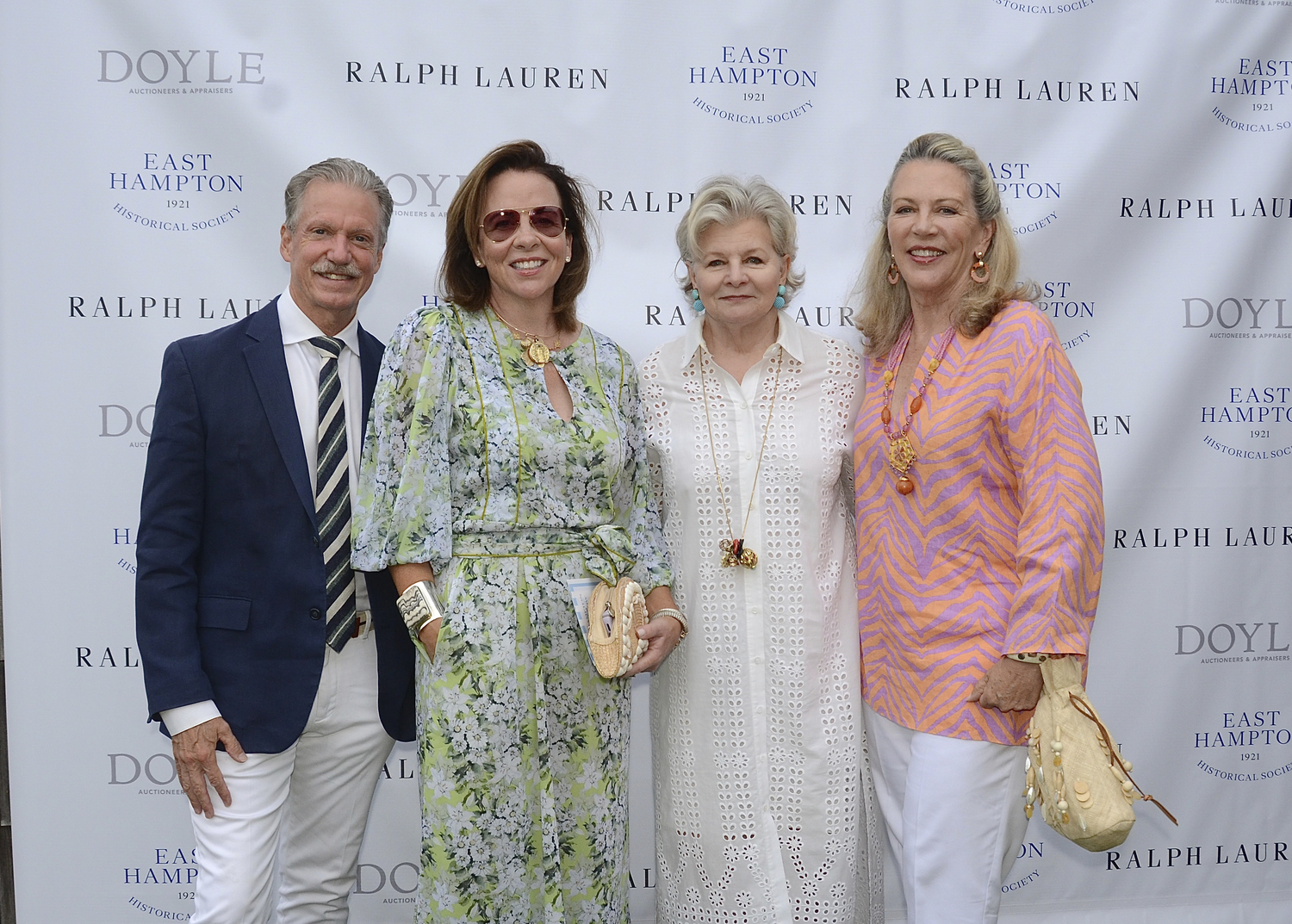 Marshall Watson, Jane Scott Hodges, Charlotte Moss and Suzanne Tucker at the preview cocktail party for the 2024 East Hampton Antiques & Design Show to benefit the East Hampton Historical Society on Friday evening on the   grounds of Mulford Farm in East Hampton Village.  KYRIL BROMLEY