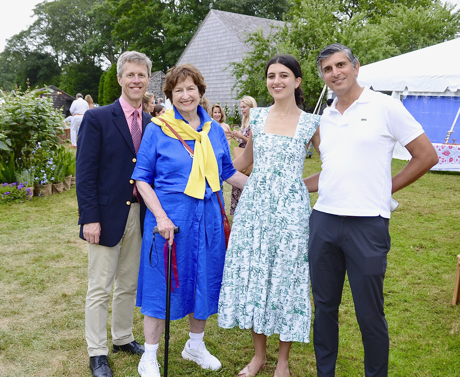 Steve Long, Kathy Doyle, Honey and Zayd Hammam at the preview cocktail party for the 2024 East Hampton Antiques & Design Show to benefit the East Hampton Historical Society on Friday evening on the   grounds of Mulford Farm in East Hampton Village.  KYRIL BROMLEY