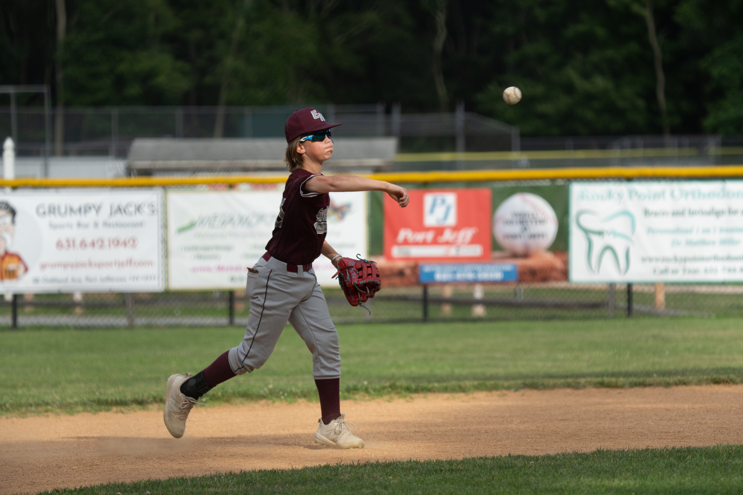 Kix Bock throwS to first base.   RON ESPOSITO