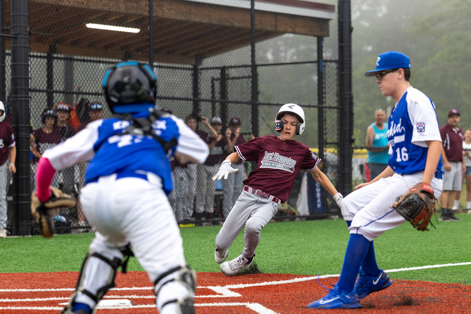 James Balnis slides into home for the game-winning run.  RON ESPOSITO