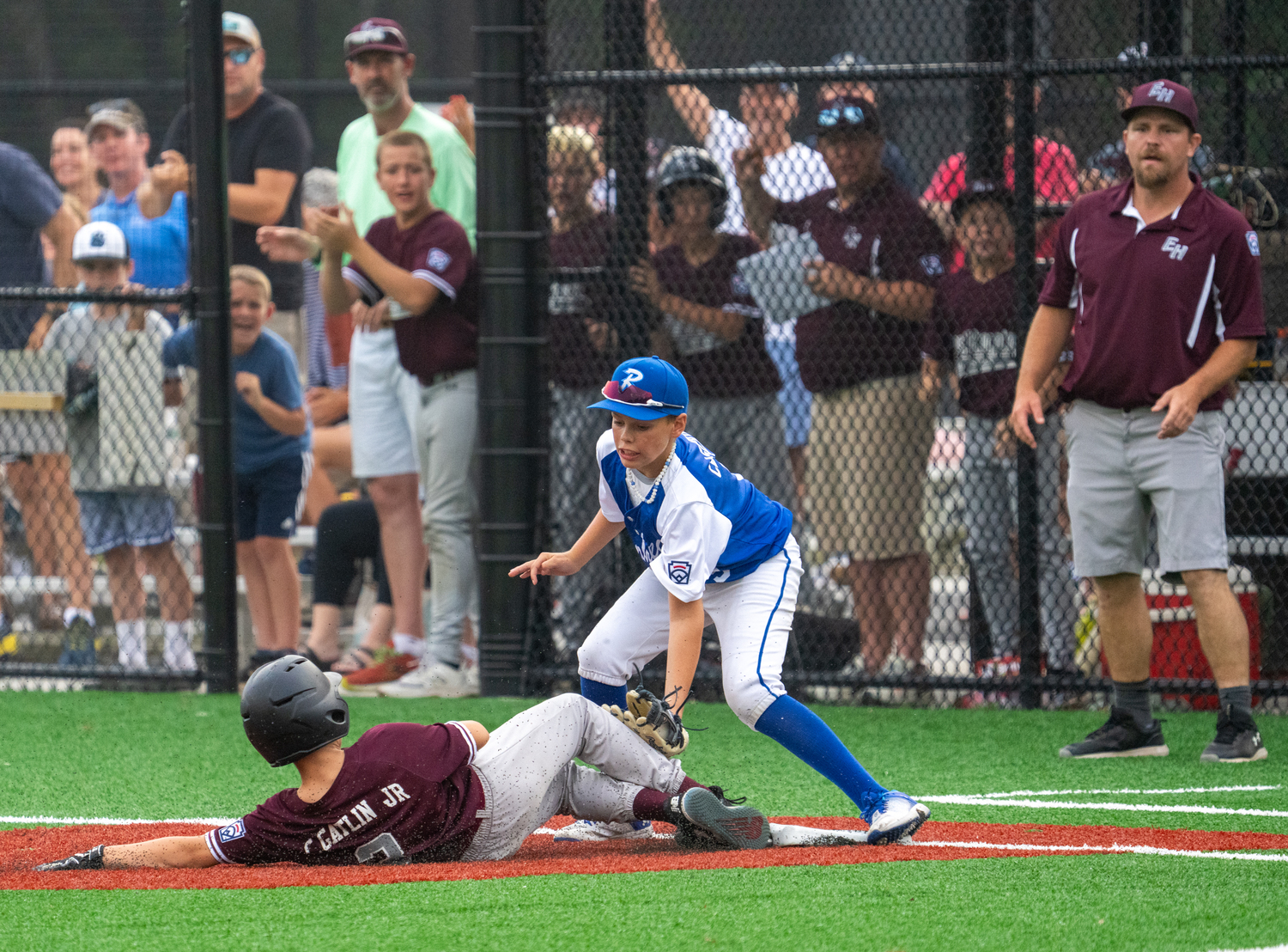 Carl Gatlin slides safely into third base.  RON ESPOSITO