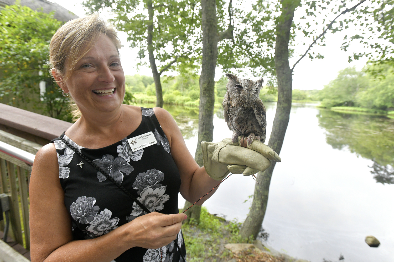 Quogue Wildlife Refuge Educator Lori Beckmann with a screech owl at the refuge's 