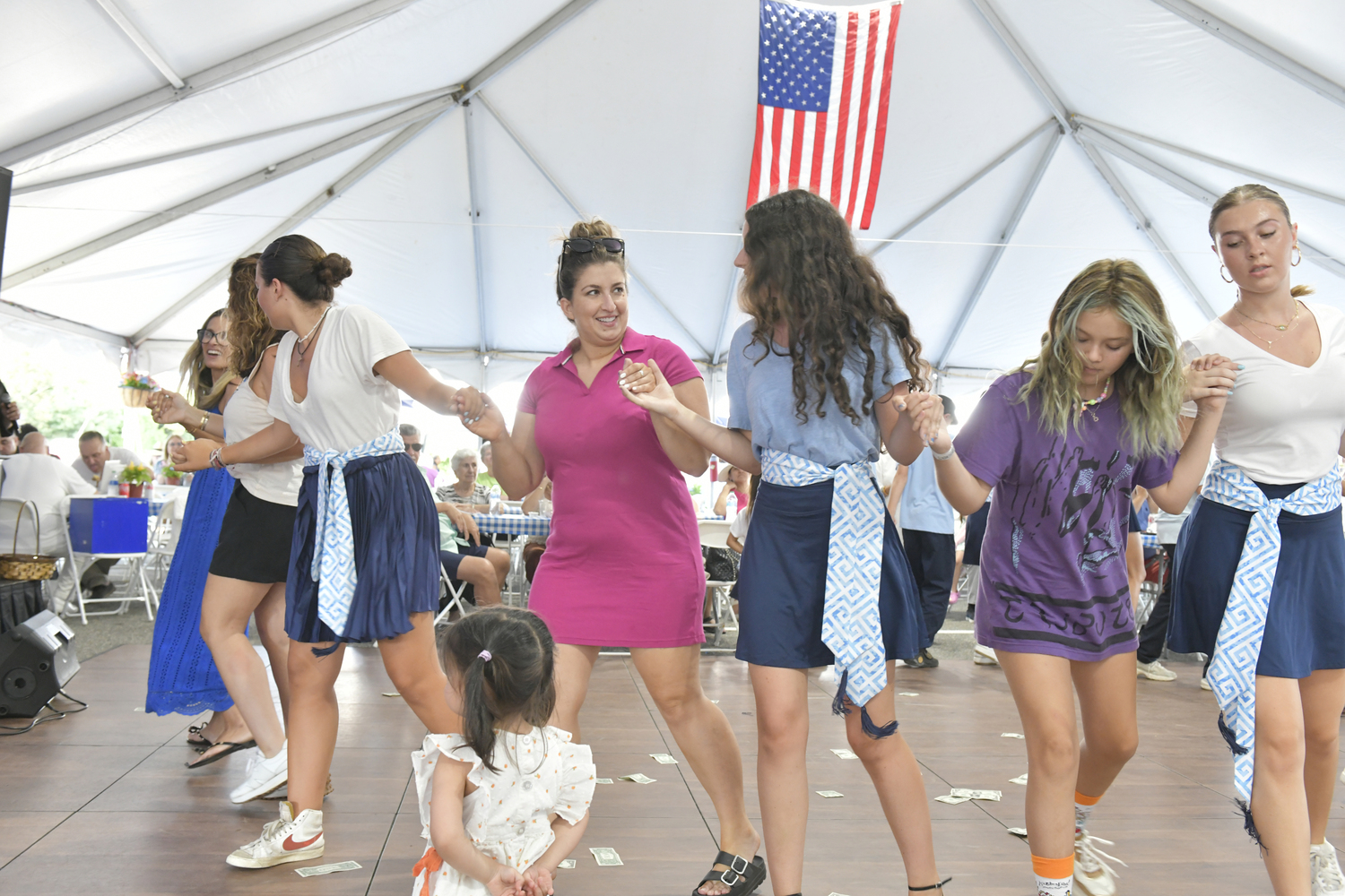 The crowd dances at the Hamptons Greek Festival on Sunday at the Dormition of the Virgin Mary Greek Orthodox Church of the Hamptons.  DANA SHAW