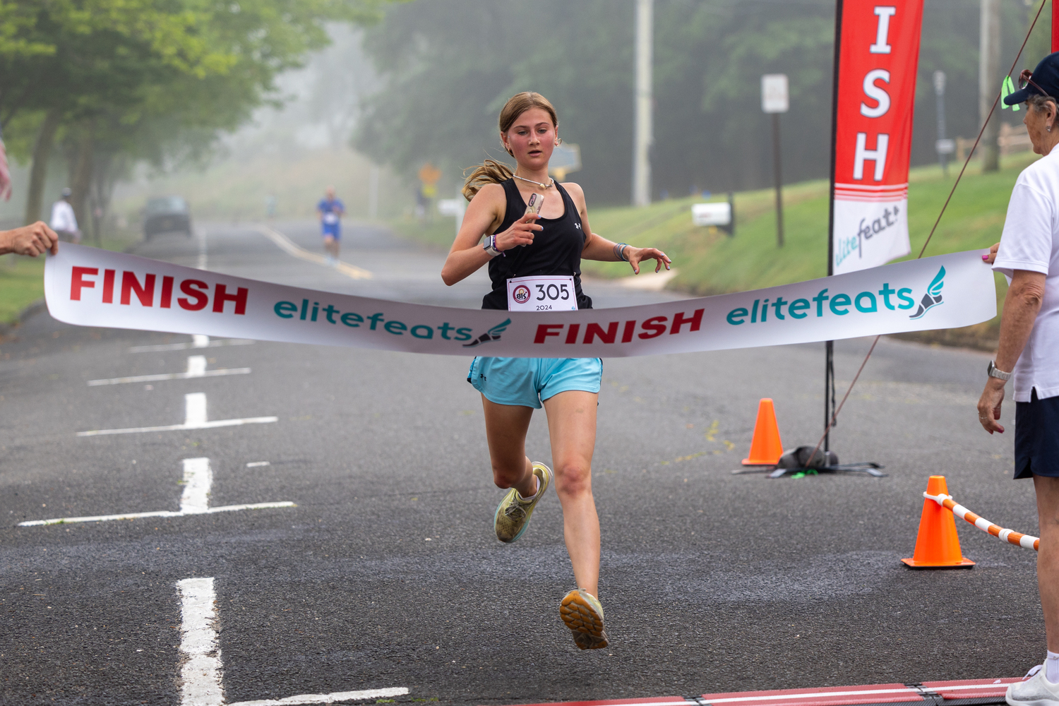 Amelia Reich-Hale of Hampton Bays was third in the 3-mile race.   RON ESPOSITO