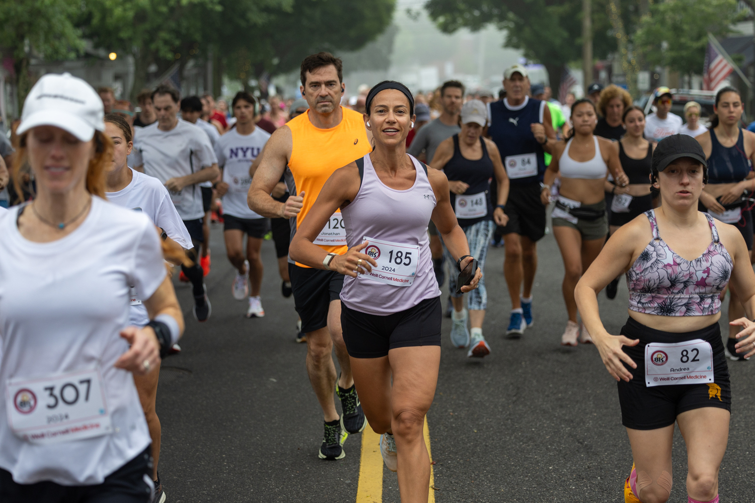 Catherine Helfand of East Hampton stands out in the crowd of runners at the start of Sunday morning's race.   RON ESPOSITO