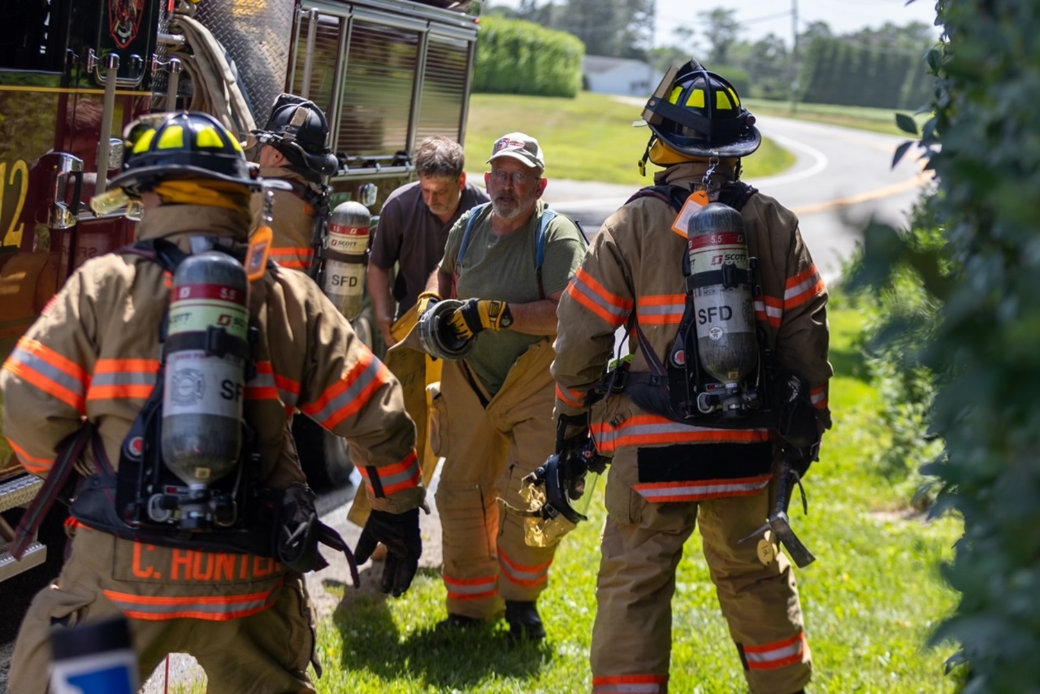 Southampton Fire Department firemen enduring a heat index the pushed over 90 degrees on Friday, extinguised a fire in the eaves a home before they spread. Firefighers were called to the Head of Pond Road home at about 2 p.m. on Friday and found smoke emanating from the attic and fascia of the house. The fire was located and extinguished quickly, the SFD communications officer Chris Brenner said. Firemen from the North Sea and Sag Harbor fire departments also responded to the scene, as did Southampton Volunteer Ambulance and Southampton Village Volunteer Ambulance because the hot weather posed a danger to firemen. The Hampton Bays Fire Department sent crews to standby at Southampton’s stations in case another alarm came in.  JULIAN TAGUE PHOTOS