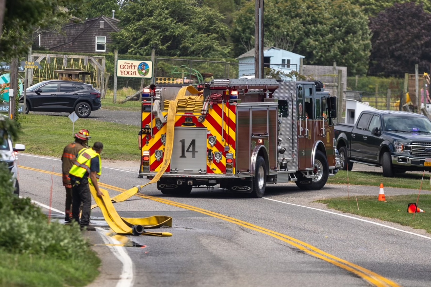 Southampton Fire Department firemen enduring a heat index the pushed over 90 degrees on Friday, extinguised a fire in the eaves a home before they spread. Firefighers were called to the Head of Pond Road home at about 2 p.m. on Friday and found smoke emanating from the attic and fascia of the house. The fire was located and extinguished quickly, the SFD communications officer Chris Brenner said. Firemen from the North Sea and Sag Harbor fire departments also responded to the scene, as did Southampton Volunteer Ambulance and Southampton Village Volunteer Ambulance because the hot weather posed a danger to firemen. The Hampton Bays Fire Department sent crews to standby at Southampton’s stations in case another alarm came in.  JULIAN TAGUE PHOTOS