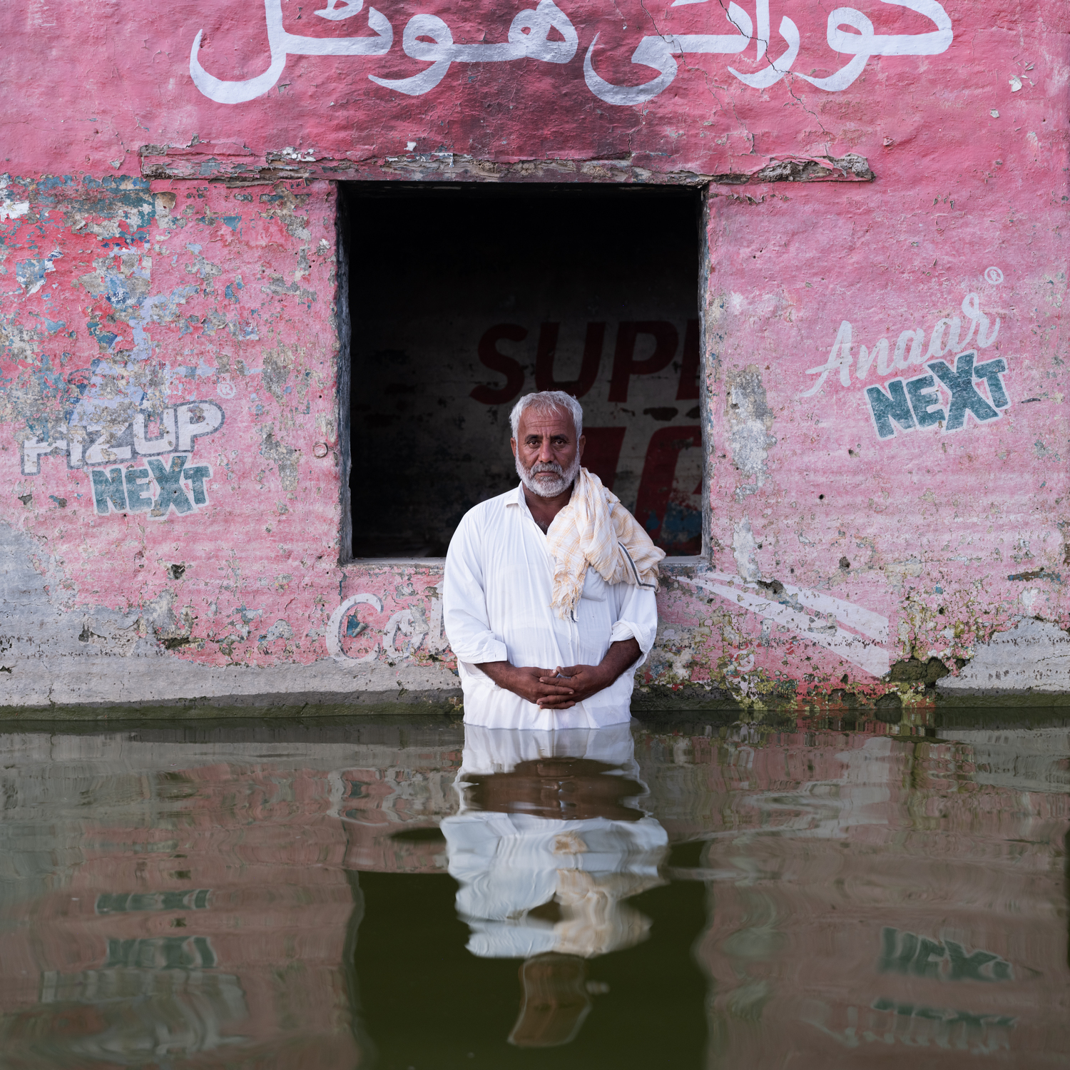 Flooding in Pakistan in 2022, which killed more than 1,500 people and left millions homeless, is depicted in the COAL + ICE exhibition at the Asia Society. GIDEON MENDEL