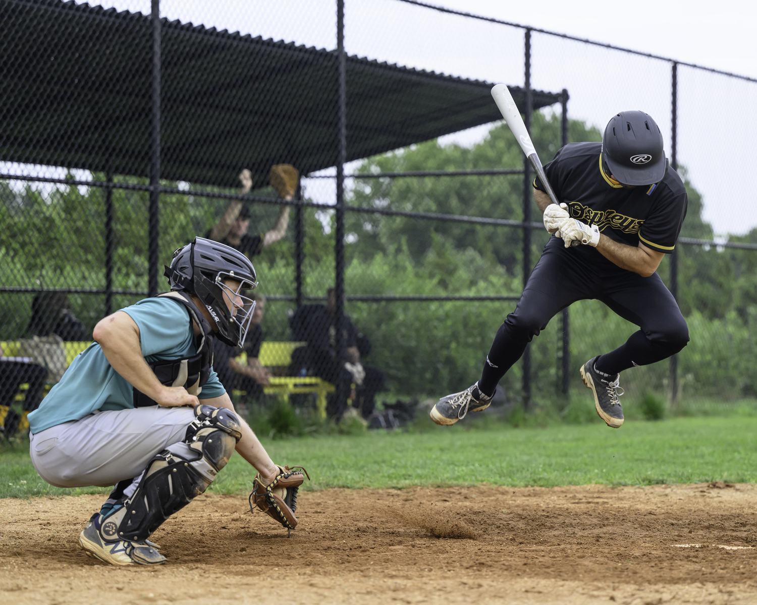 An Ospreys batter leaps out of the way of a wild pitch.   MARIANNE BARNETT