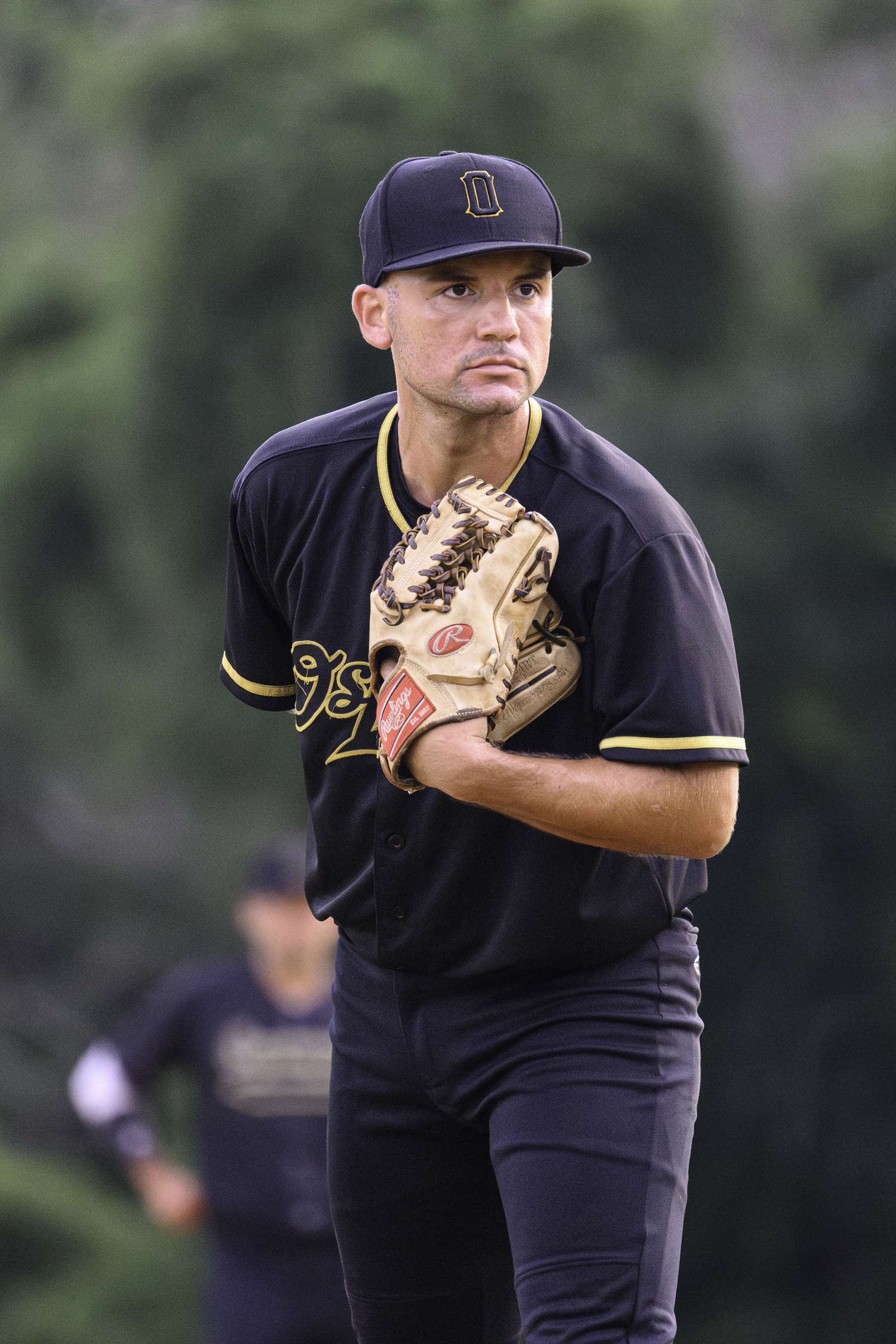 An Ospreys pitcher looks in.  MARIANNE BARNETT