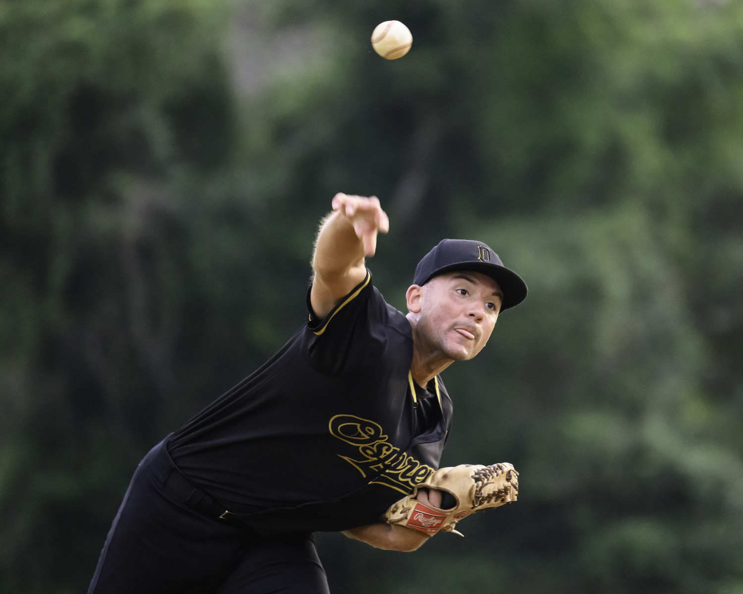 An Ospreys pitcher delivers a pitch.  MARIANNE BARNETT