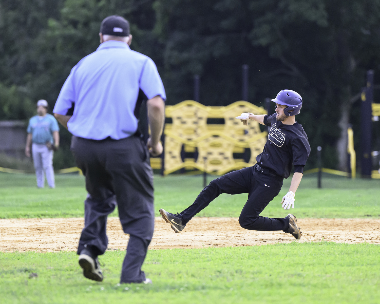 An Ospreys baserunner slides into second base.   MARIANNE BARNETT