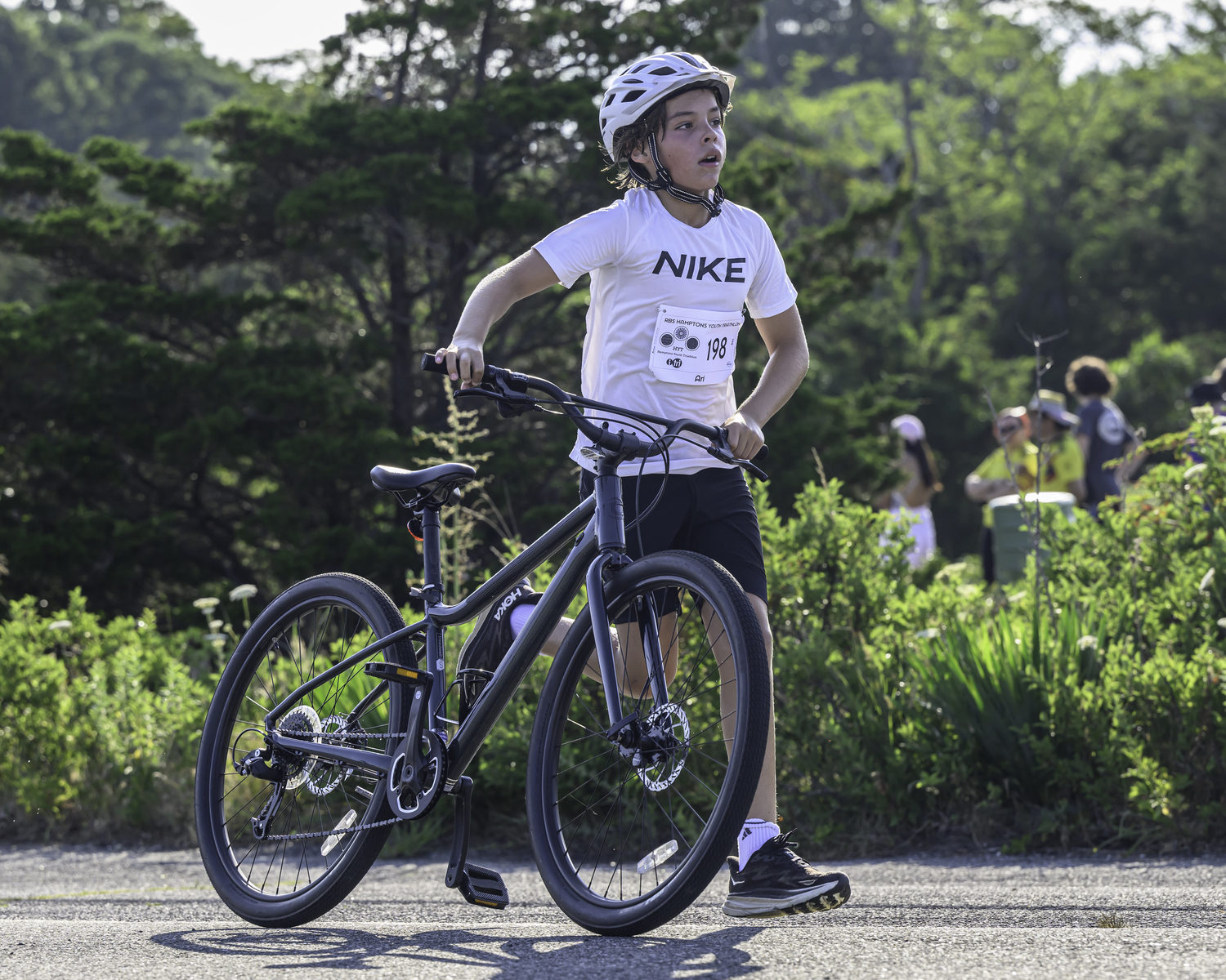 Ari Nadel of Amagansett starts the bike portion of the triathlon.   MARIANNE BARNETT