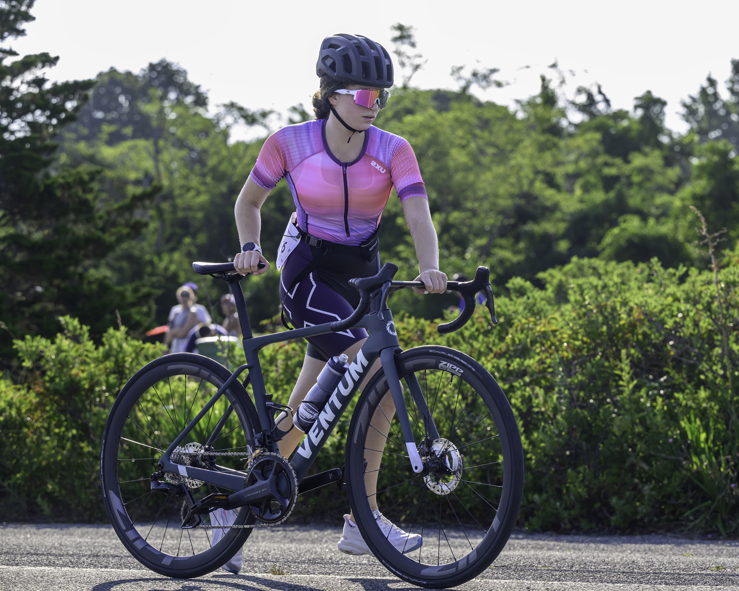 A triathlete finishes up the bike portion.  MARIANNE BARNETT