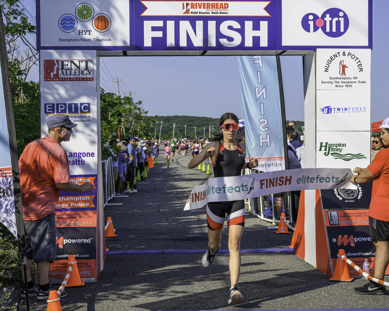 Catherine Bailey of Port Jefferson crosses the finish line second overall.  MARIANNE BARNETT