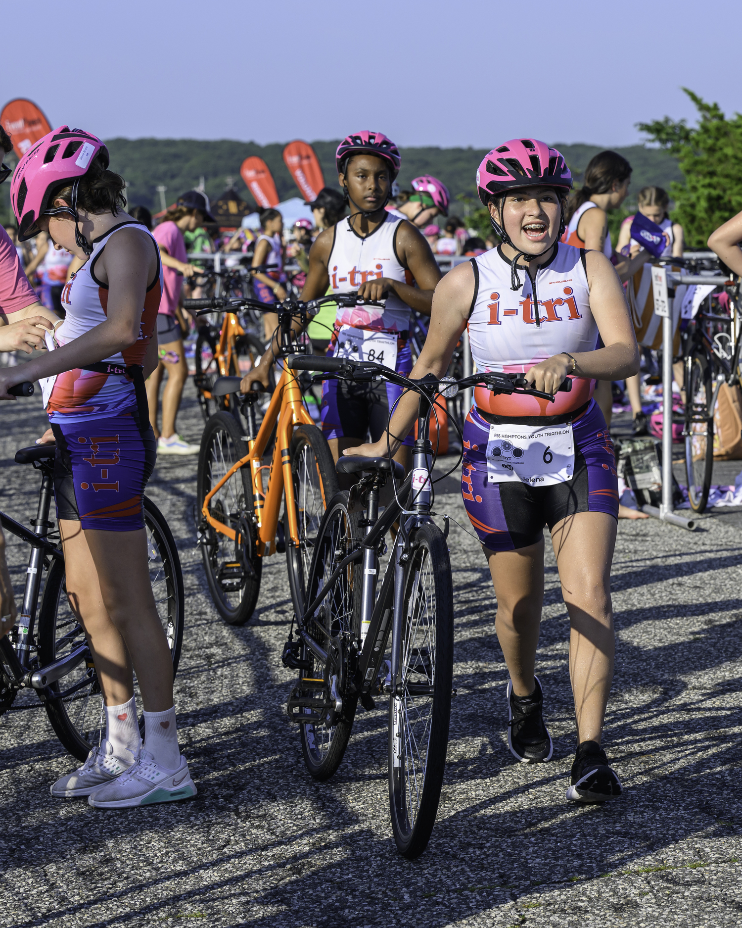 Jelena Arango Taborda of Mastic, and London Lomx of Shirley right behind her, start the bike portion of the triathlon.   MARIANNE BARNETT