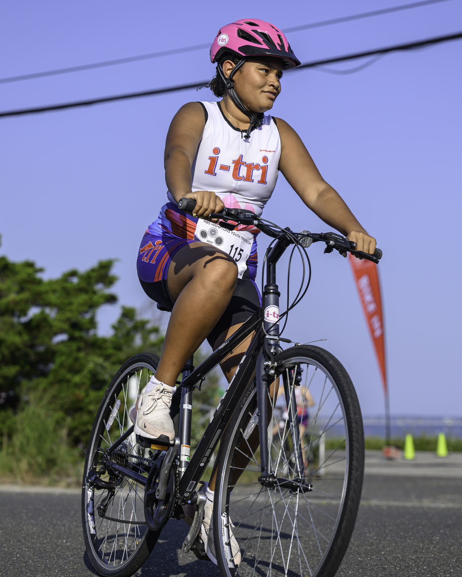 Maya Ollennu of Hampton Bays in the bike portion of the Hamptons Youth Triathlon on Sunday.   MARIANNE BARNETT