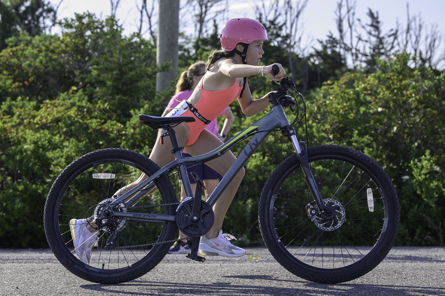 Evelyn Rizzo comes in on her bike.  MARIANNE BARNETT