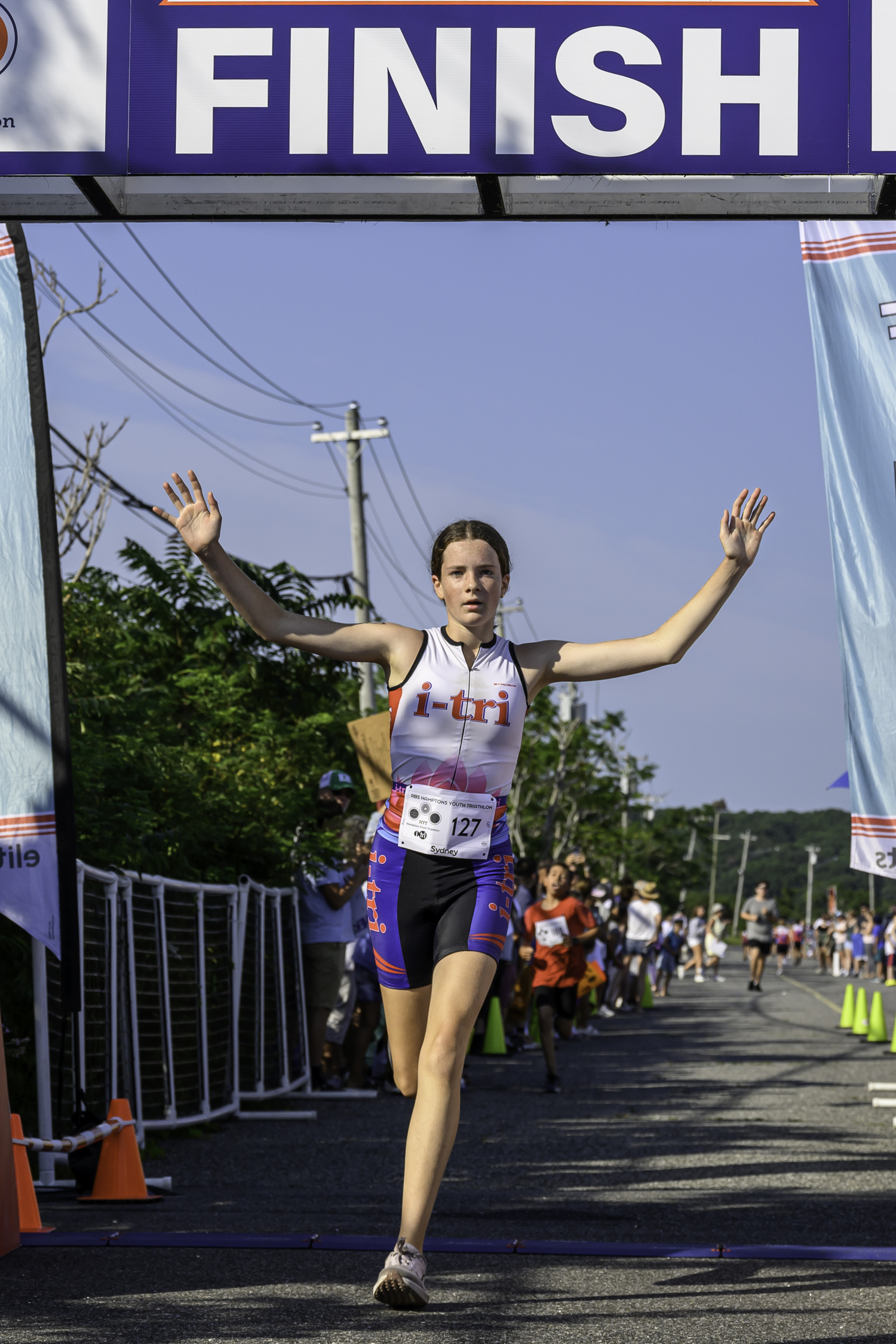 Sydney Powers of Montauk crosses the finish line.  MARIANNE BARNETT