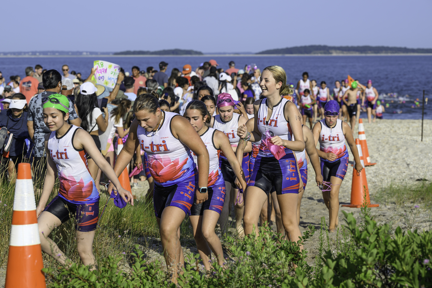 The girls transition from the swim to the bike portion of the triathlon.  MARIANNE BARNETT