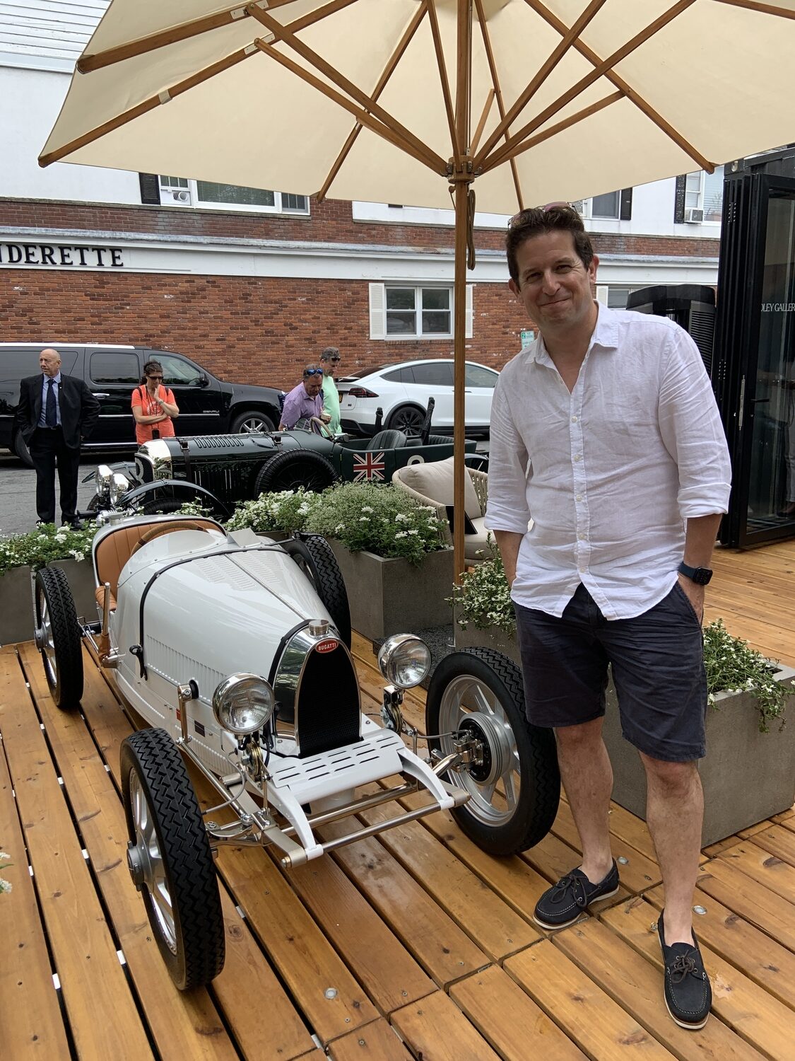 Ben Hedley with a scale model of a Bugatti Type 35 racecar, which got him started on a quest to design and build perfect replicas of some of the world's most famous cars. STEPHEN J. KOTZ