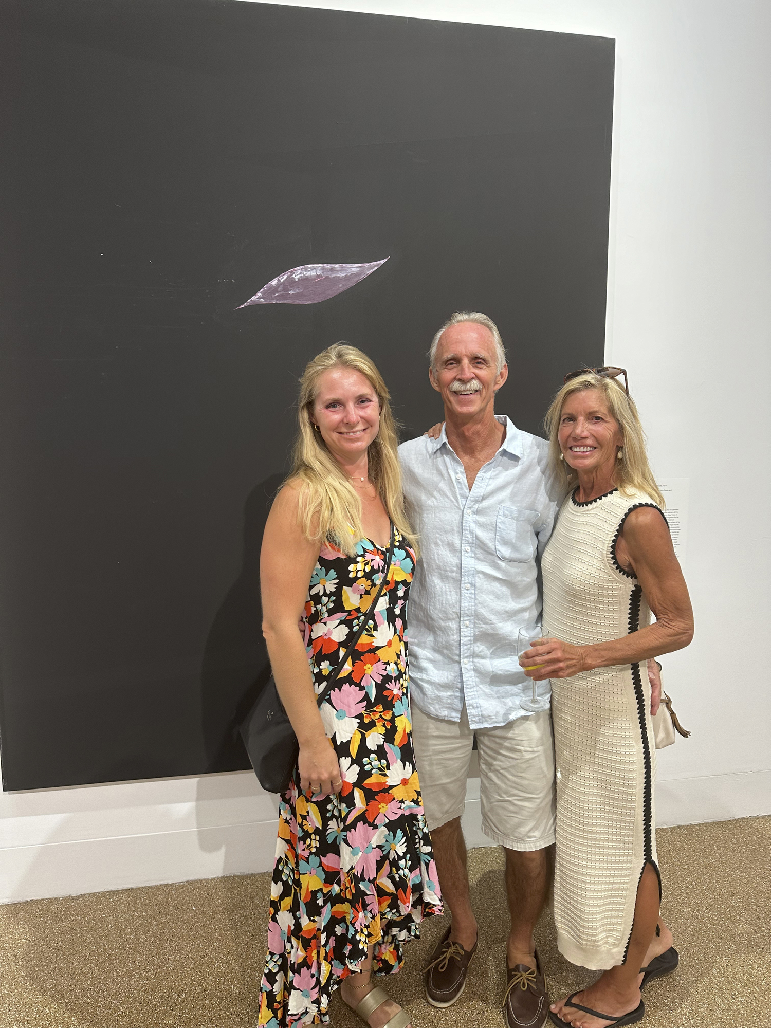 Kate and Hal Gromantsky and Lori Tortorice at the Southampton Art Center.  GREGORY D'ELIA