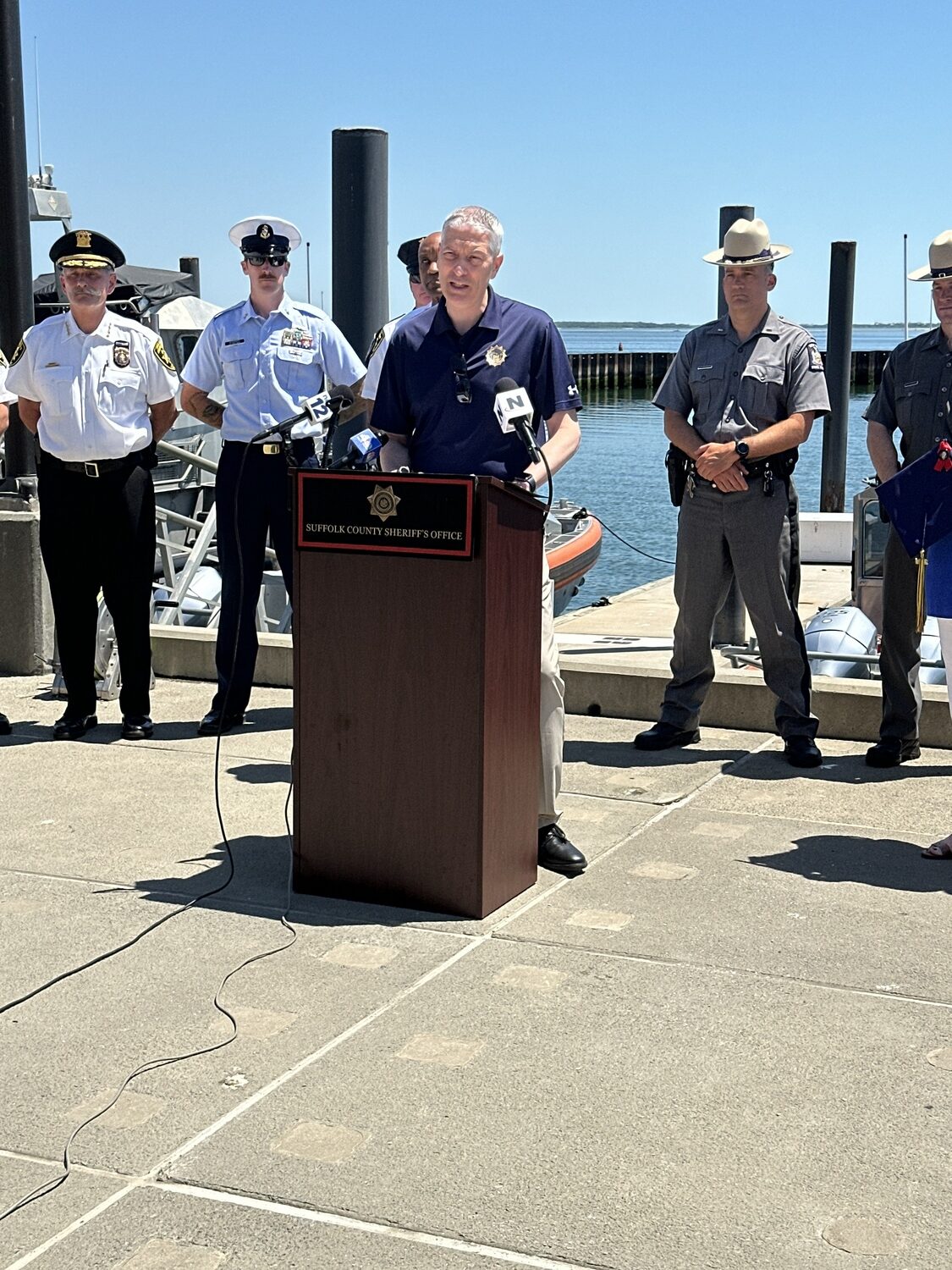 Chief Assistant District Attorney Allen Bode speaks at the U.S. Coast Guard Station Shinnecock on Tuesday. DAN STARK