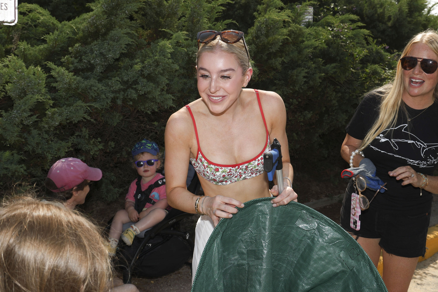 Gracie Cashman and Kelly Brady helped remove four garbage bags' worth of trash at South Edison Beach in Montauk on Saturday. ROB RICH