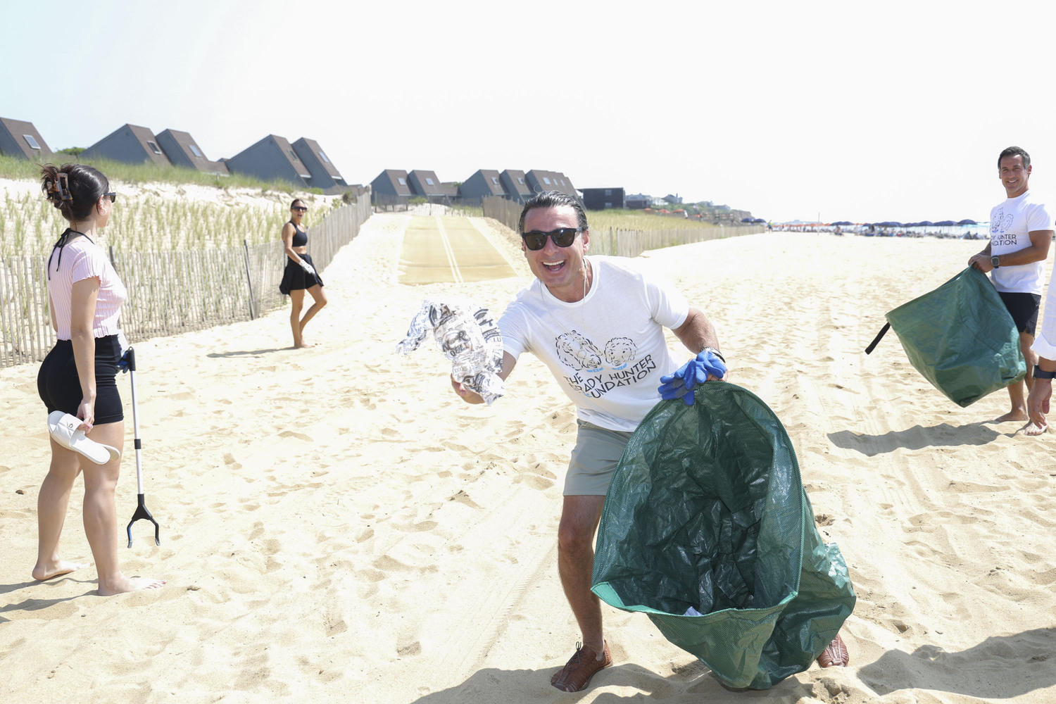 Gary Bierfriend got in on the fun, helping Project Zero and the Montauk Beach House-led beach cleanup in Montauk's downtown on Saturday. ROB RICH