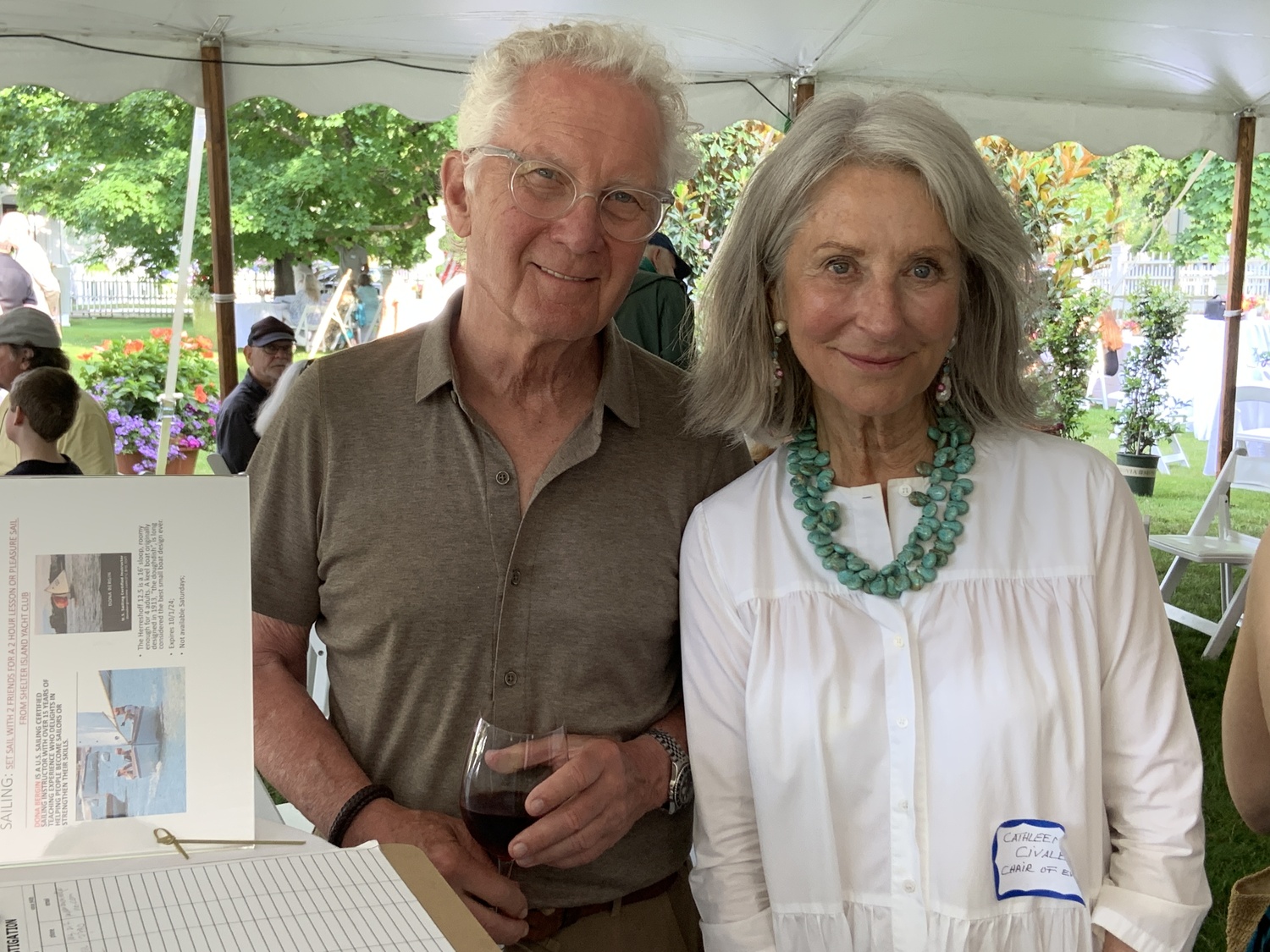 Joe Fisher and Cathleen Civale at the Sag Harbor Historical Museum's summer party on the Custom House grounds. STEPHEN J. KOTZ