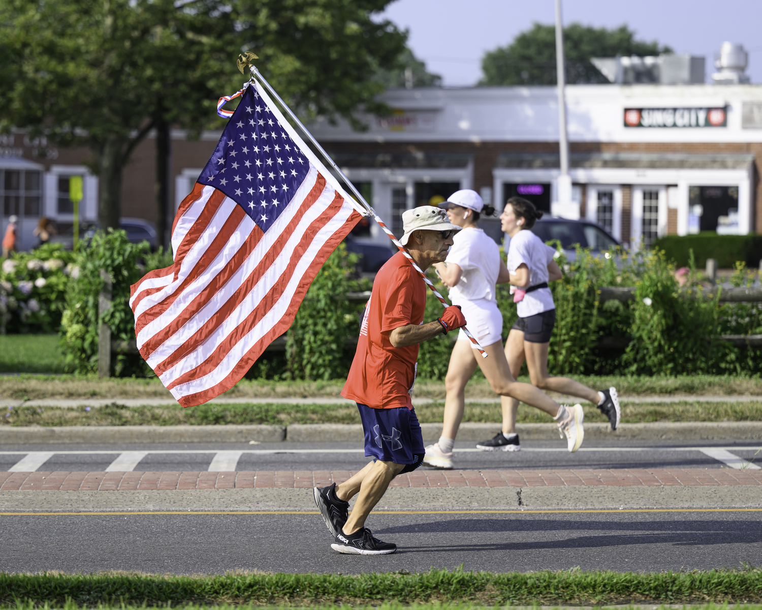 Joe Sferrazza carries the flag. MARIANNE BARNETT