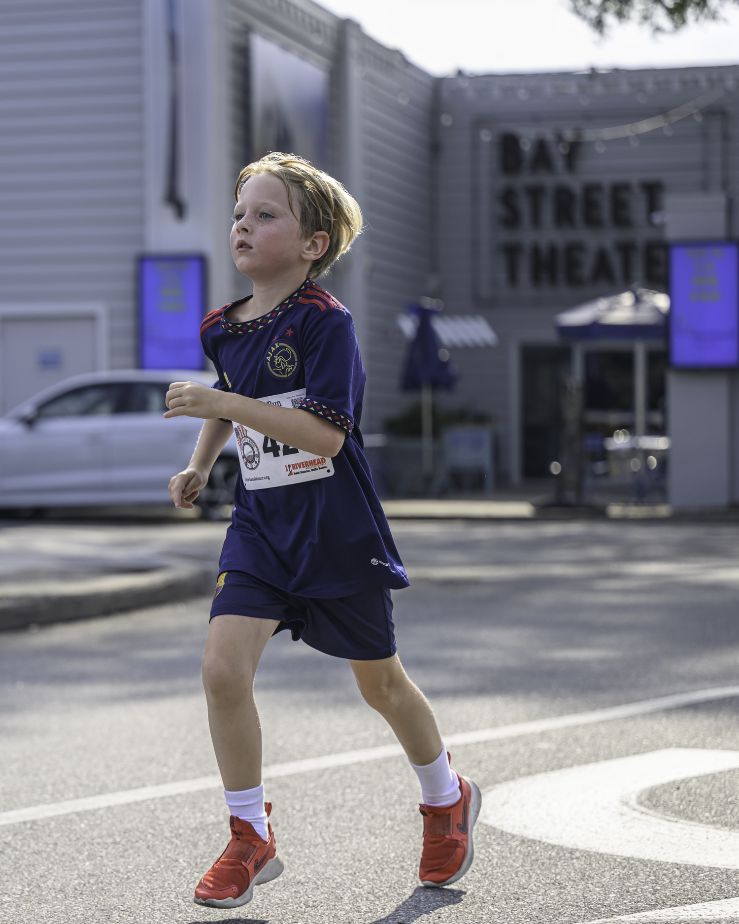 A Water Mill boy competes in Sunday's race.   MARIANNE BARNETT