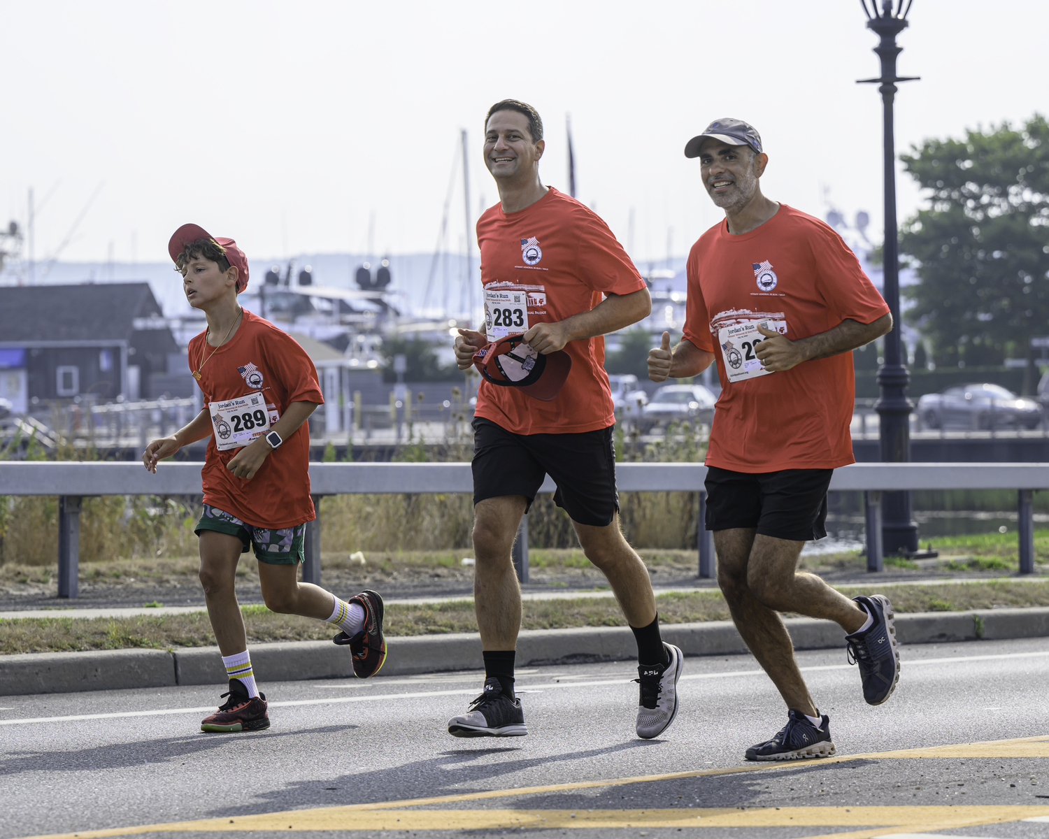 Members of the Turowsky family and Michael D'Angelo, center, running on Sunday.   MARIANNE BARNETT