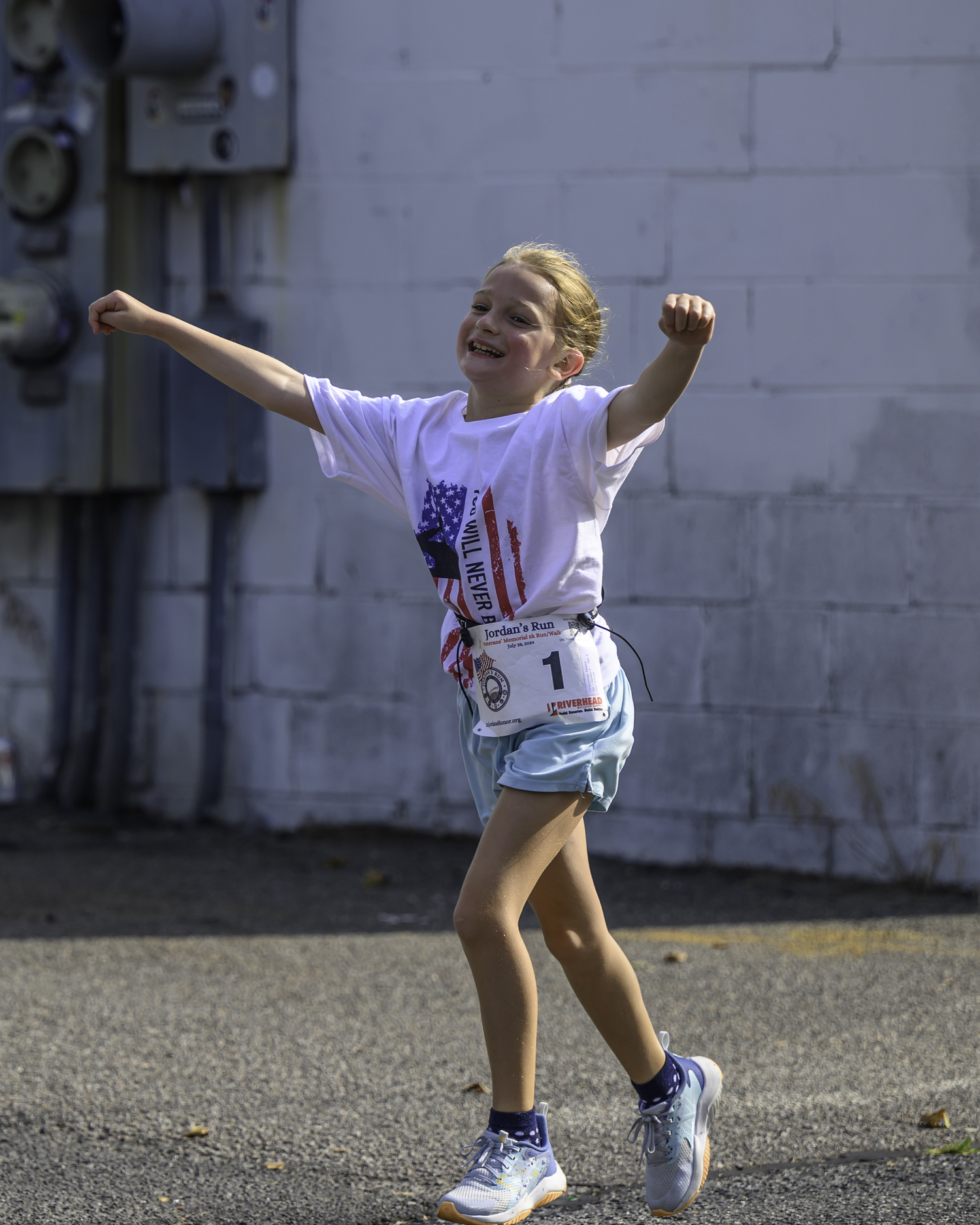 A young runner from Riverhead takes part in the race. MARIANNE BARNETT