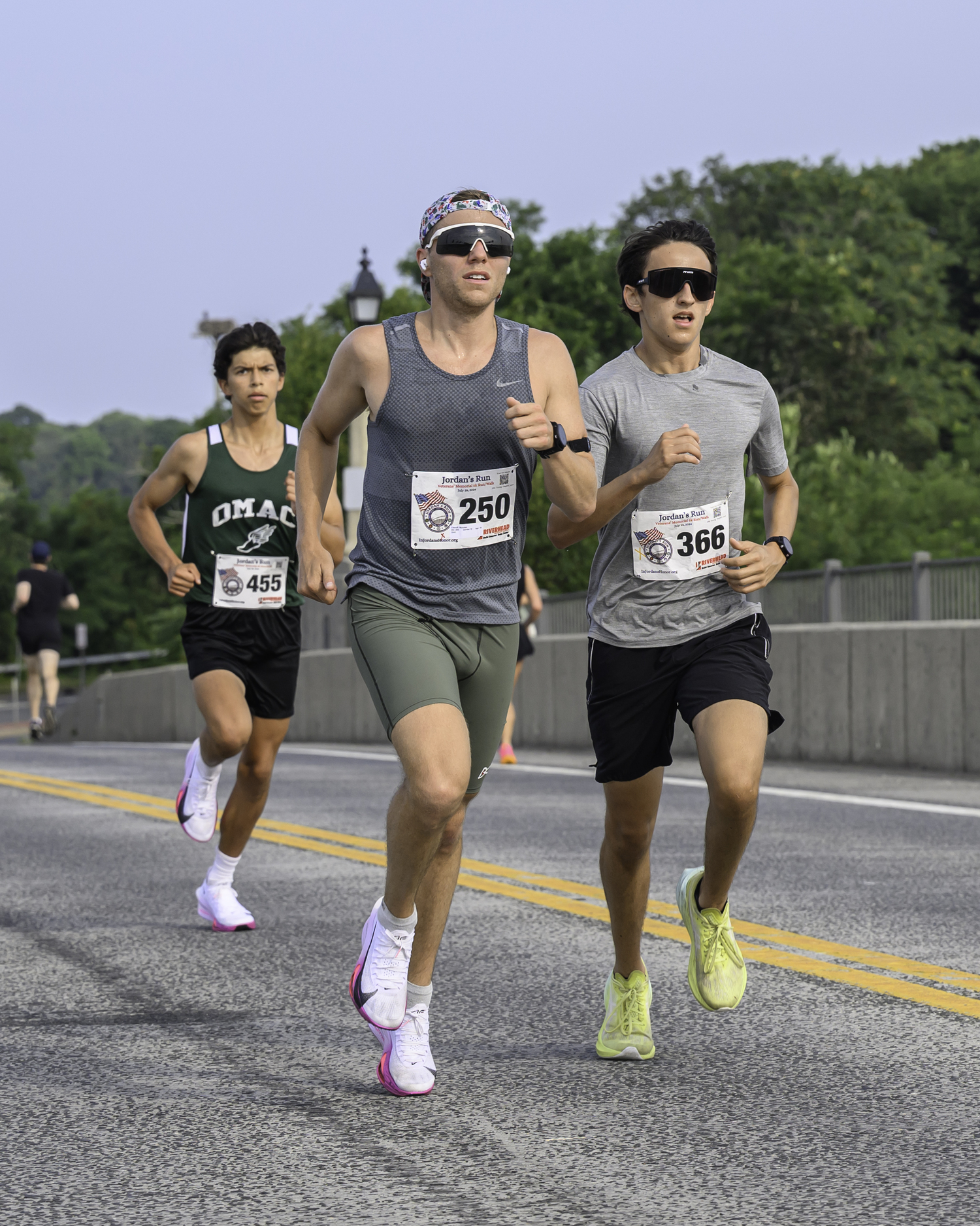 Nicholas Ellenoff has a slight lead on Justin Gardiner and Edmar Gonzalez-Nateras as they come back over the bridge.   MARIANNE BARNETT