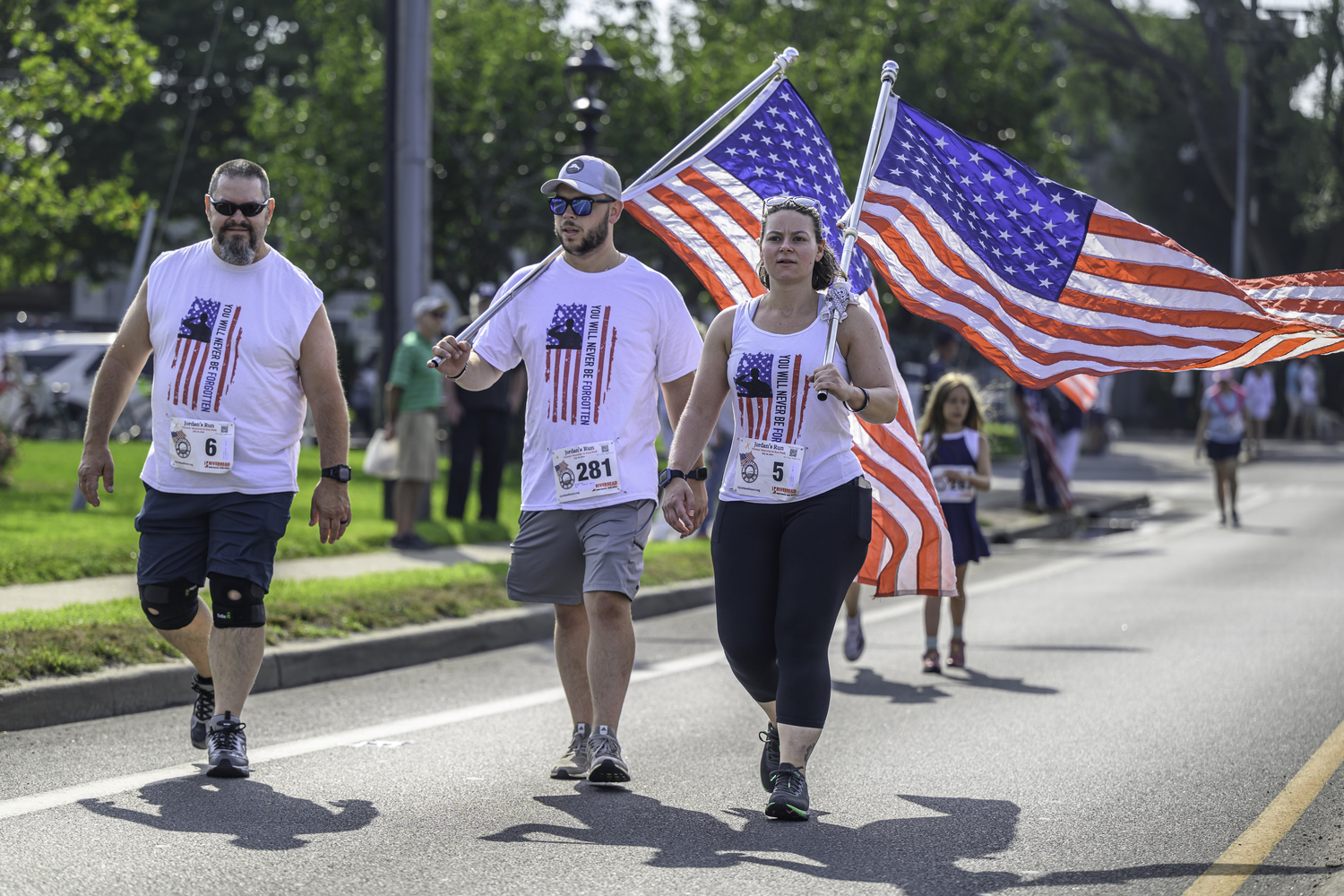 Chris Arbia, left, Mike Mongiello and Cassie Arbia walking to support Jordan's Run on Sunday morning.   MARIANNE BARNETT