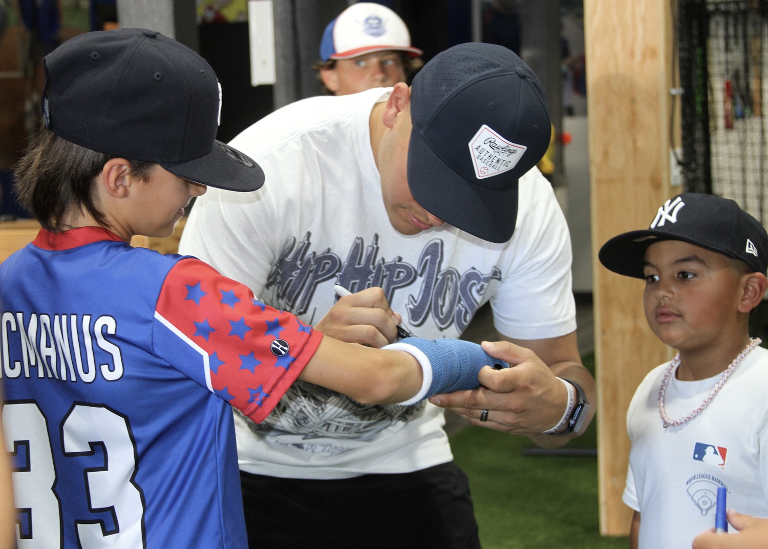 New York Yankees catcher Jose Trevino signs Logan McManus's cast. DESIRÉE KEEGAN