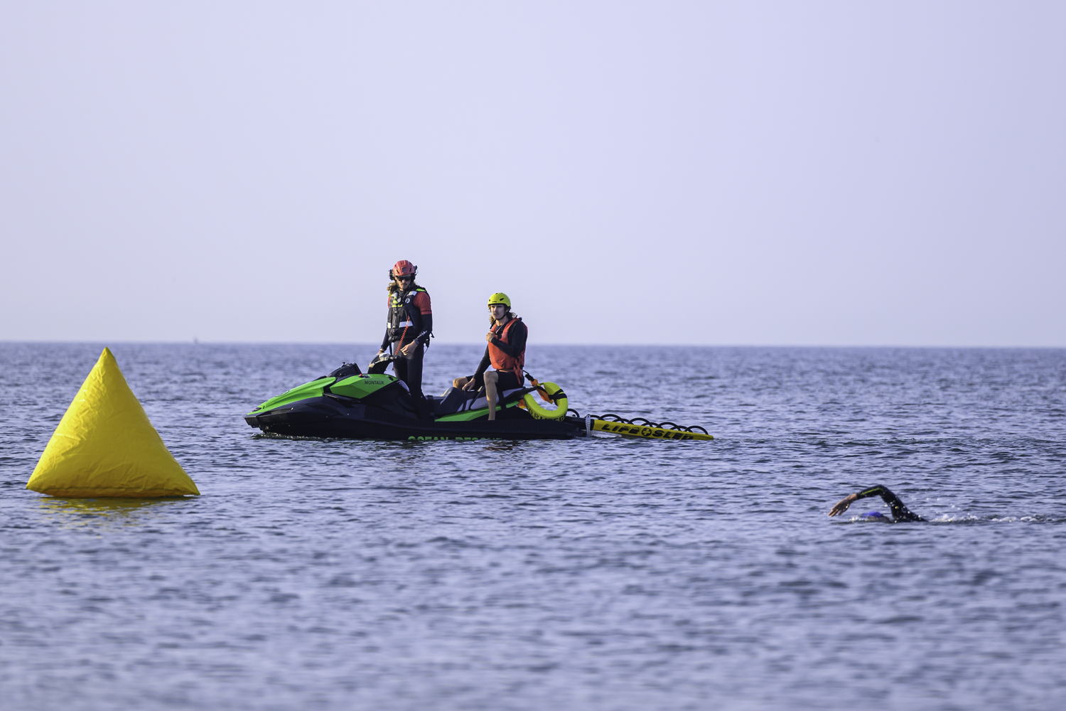 East Hampton Volunteer Ocean Rescue monitors Michal Petrzela, in the lead of the 2-mile swim.   MARIANNE BARNETT