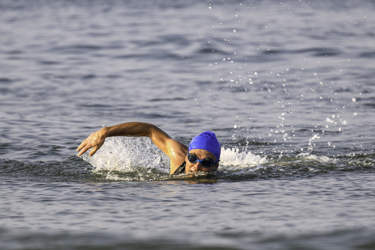 A finisher in the 2-mile swim comes in.   MARIANNE BARNETT