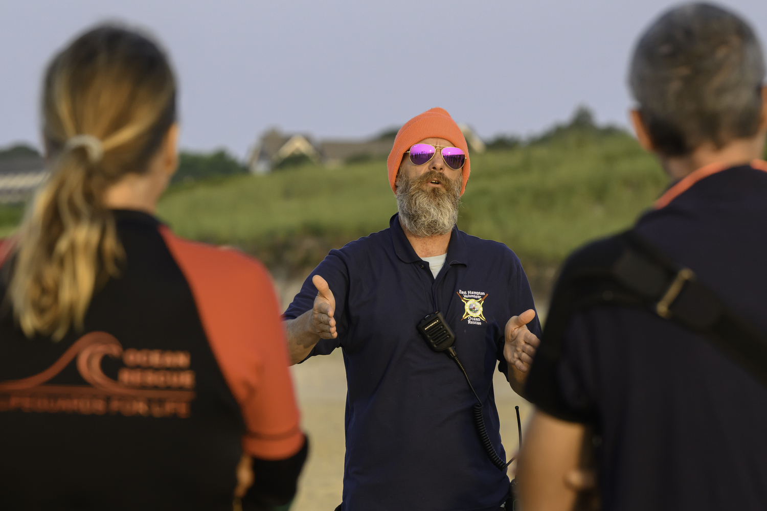 An East Hampton Volunteer Ocean Rescue member goes after safety protocols with fellow members.  MARIANNE BARNETT