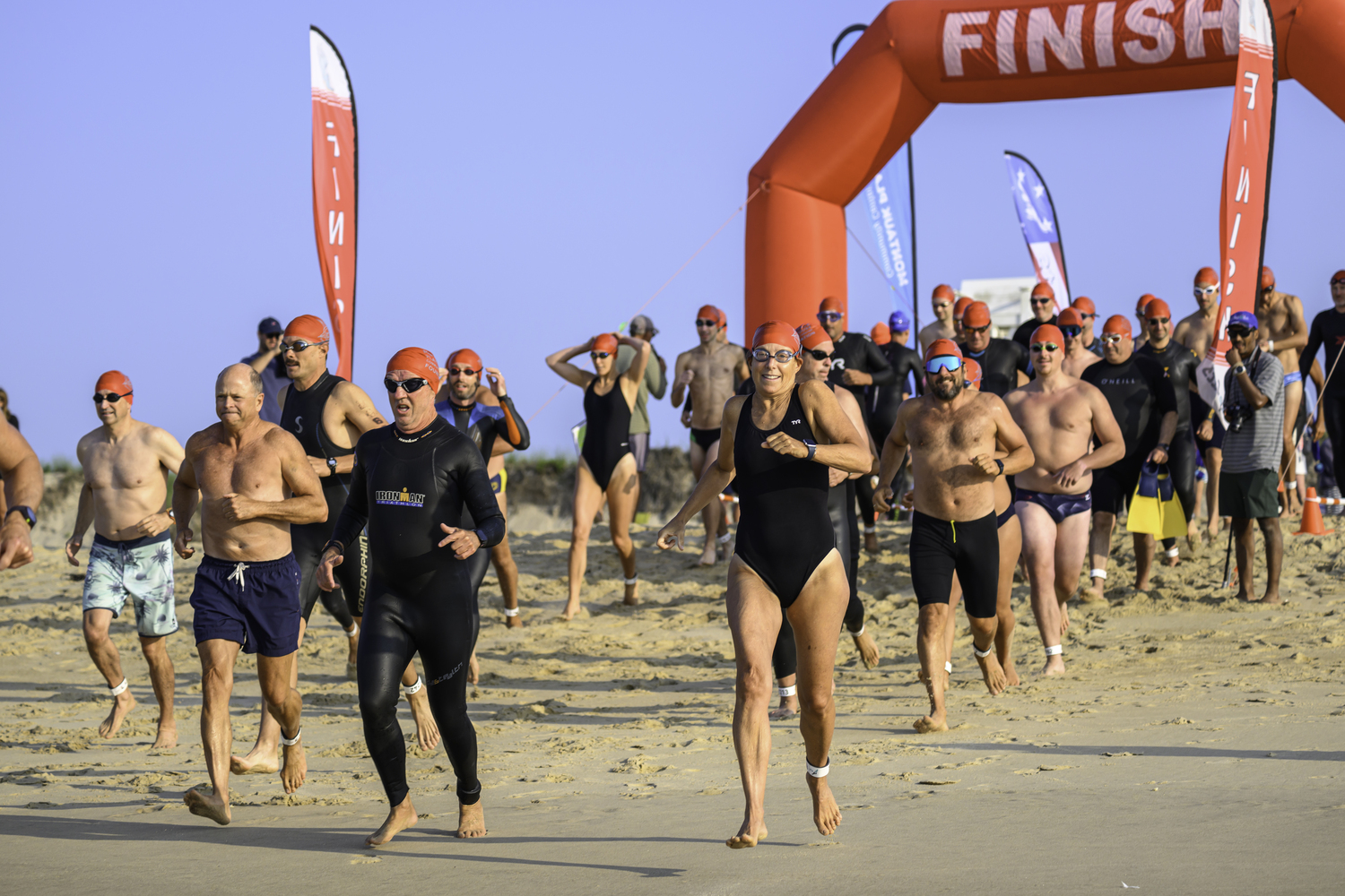 The 1-mile swimmers head into the ocean.  MARIANNE BARNETT