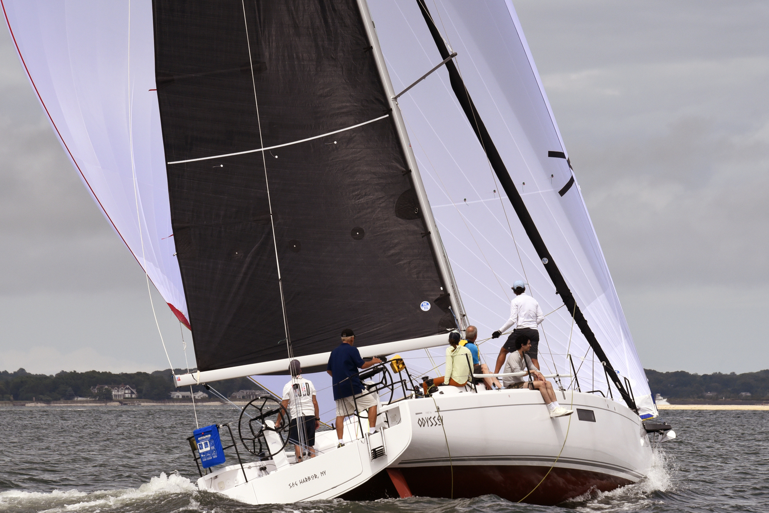 Odyssey, Ray Pepi’s double wheel; double rudder First 36 flying her spinnaker in a breeze.   MICHAEL MELLA