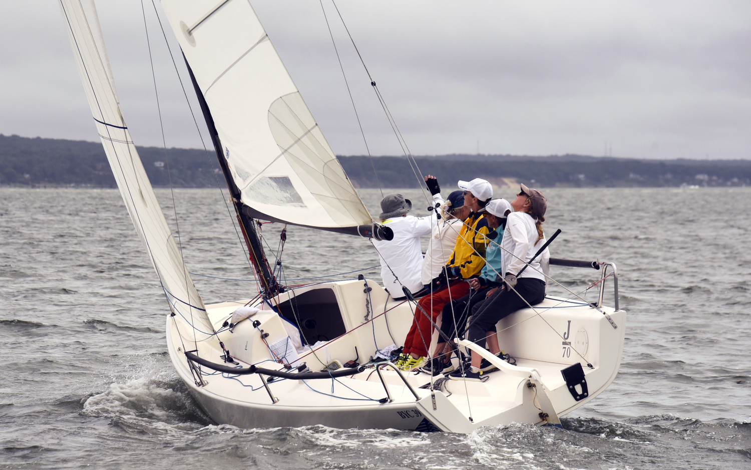 #67: Skipper Sarah Alford, focused on the jib’s telltales, heading her J-70 up in a puff.  MICHAEL MELLA