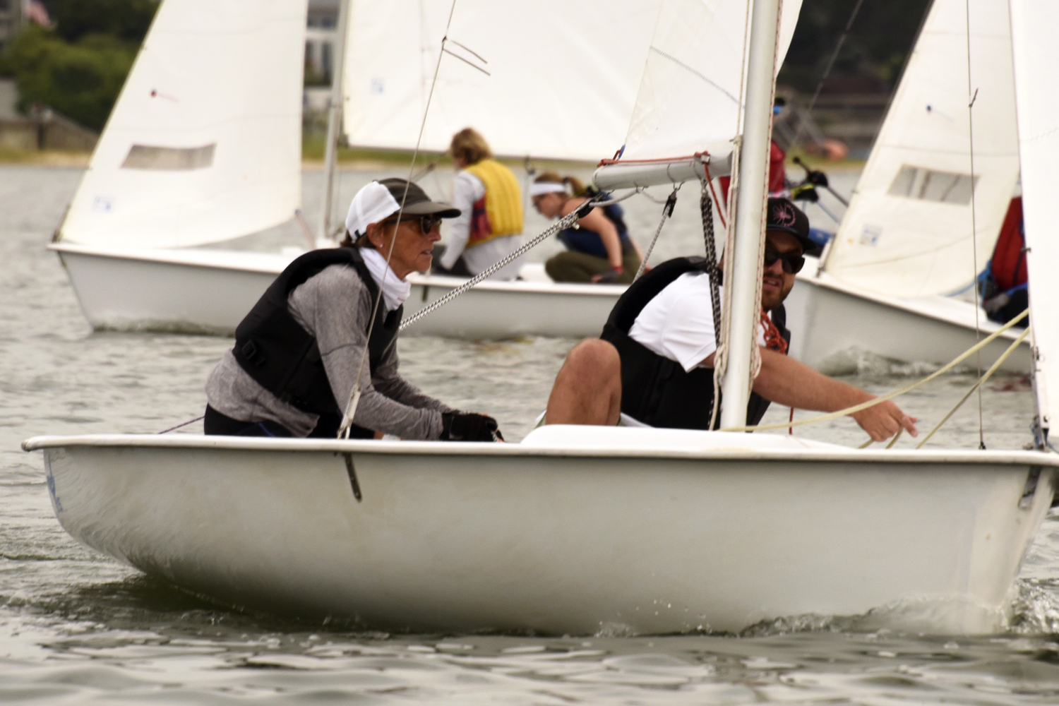 Joan Butler, one of the club’s most highly respected sailors, with her son Seth Barrows after jibing around the leeward mark. Back in April, with Seth on the helm and Joan “up front,” they won the JY15 Long Island Championship Regatta. MICHAEL MELLA