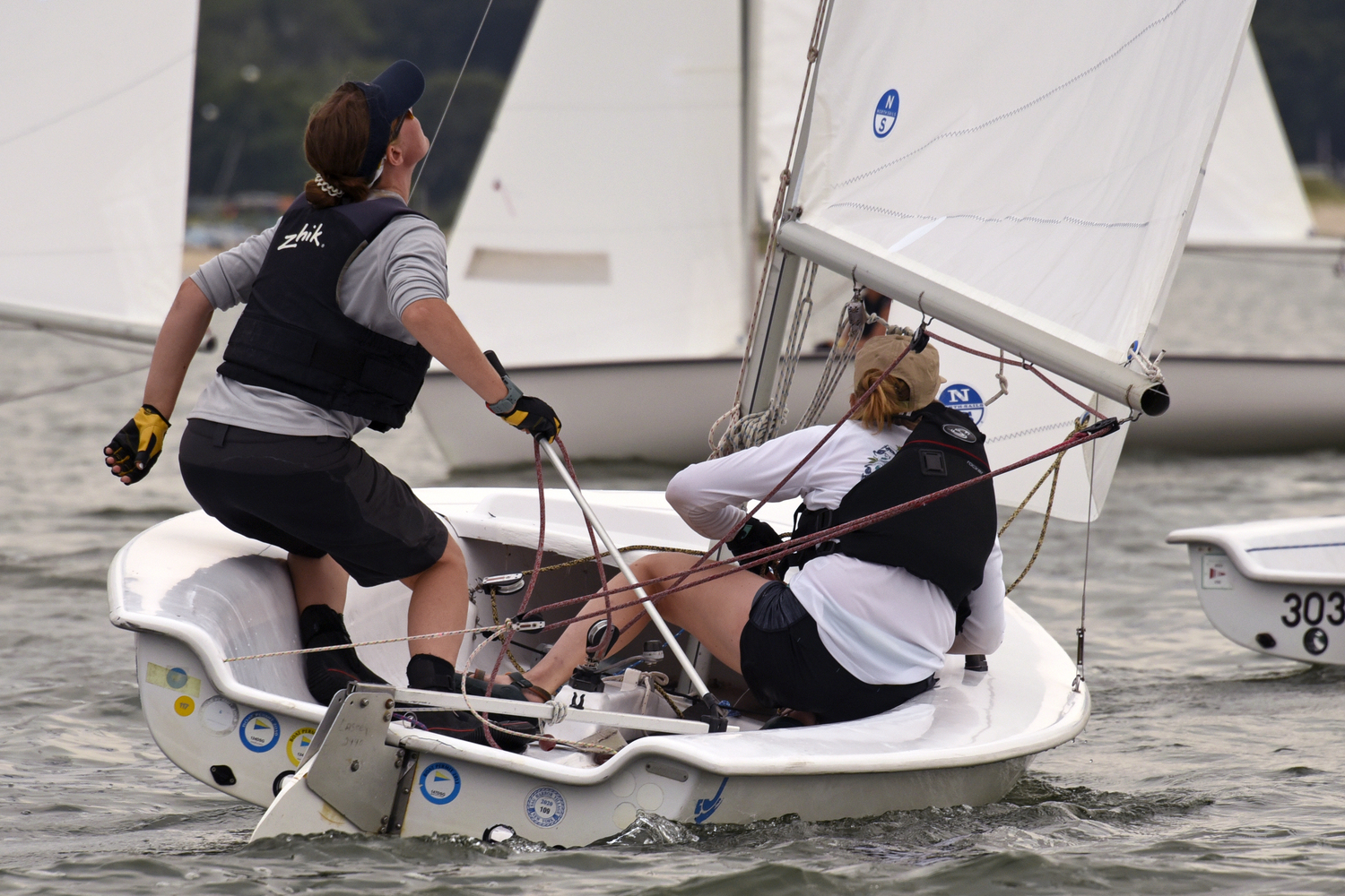 Caitlin Cummings, after executing a stellar jibe with her sister Elizabeth, steers toward a close-hauled point of sail. MICHAEL MELLA