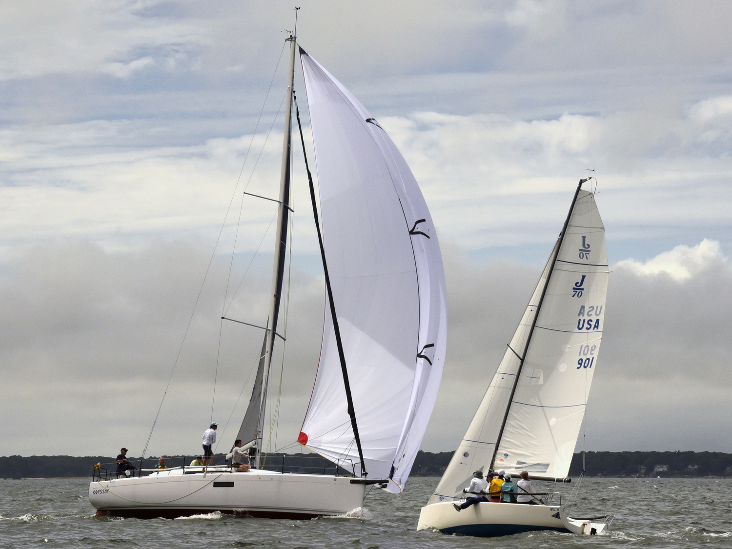 Starboard tack Odyssey, left, forcing right-of-way on the all women BYC’s port tack J-70, helmed by Sarah Alford.  MICHAEL MELLA