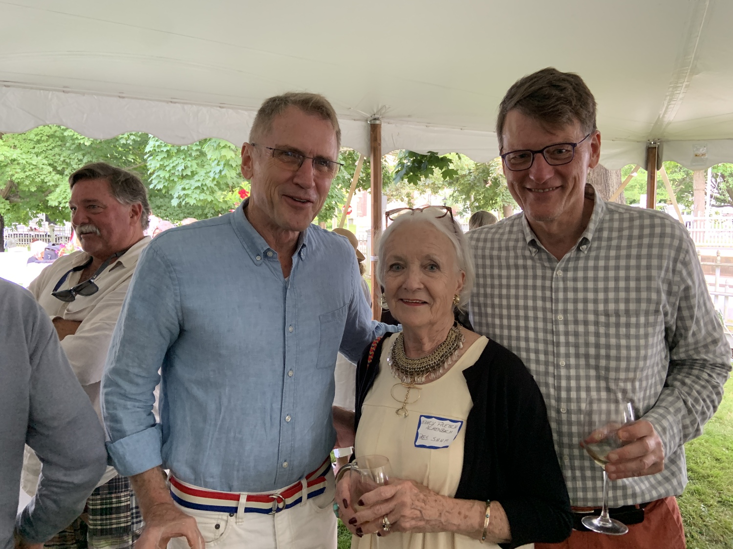 Sag Harbor Historical Museum President Nancy French Achenbach with Ted Porter, left, and Steve Godlike at the museum's annual summer fundraising party. STEPHEN J. KOTZ