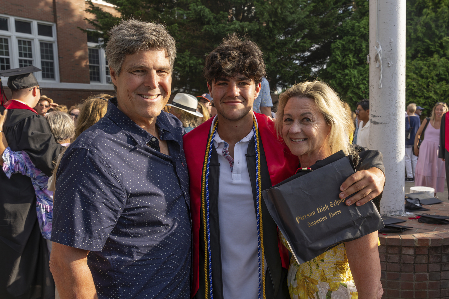 Michael Hayes, graduate Gus Hayes and Marianne Barnett at Pierson graduation on Saturday evening.  RON ESPOSITO