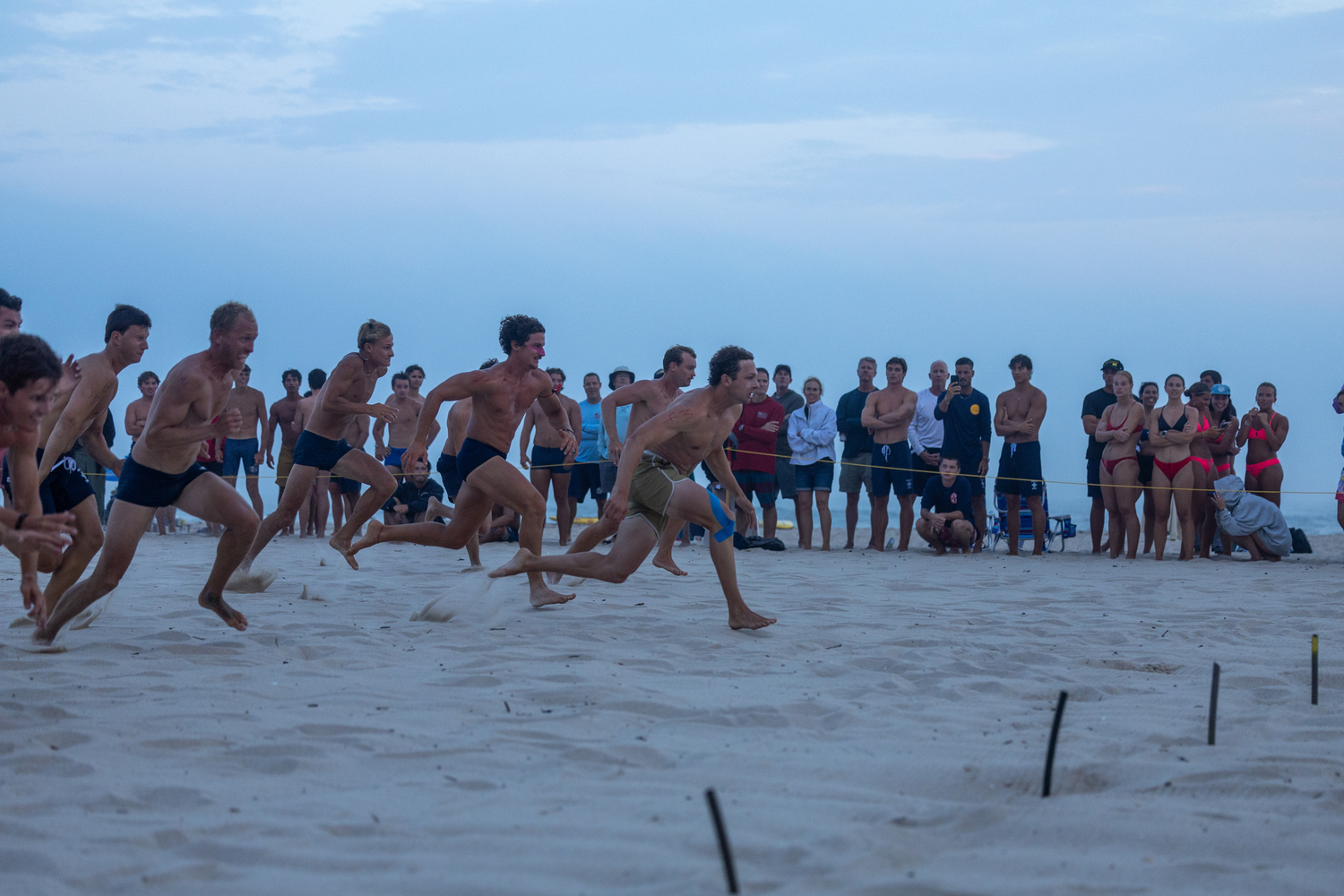 The men compete in the beach flags.   RON ESPOSITO